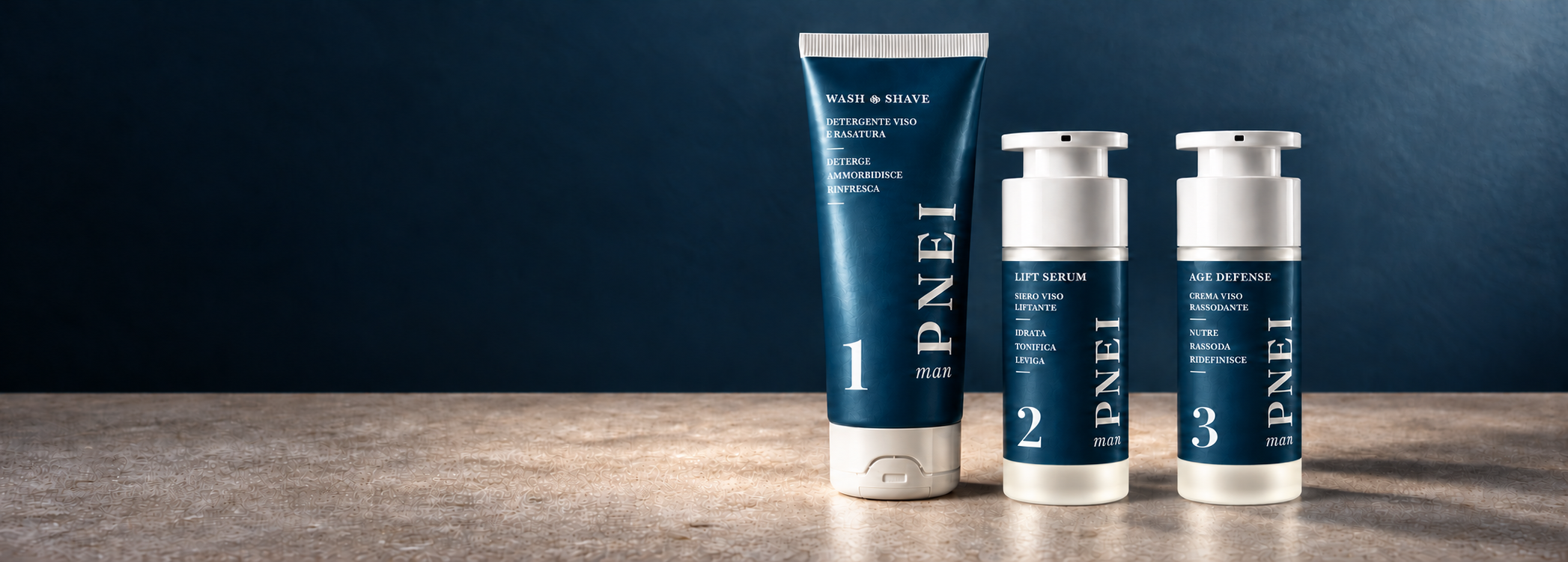 Linea PNEI man: detergente viso e rasatura, siero viso liftante e crema viso rassodante su un piano in pietra